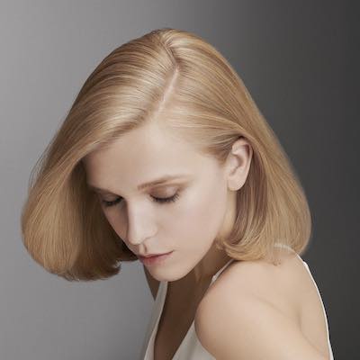 woman with styled hair after salon hair treatment