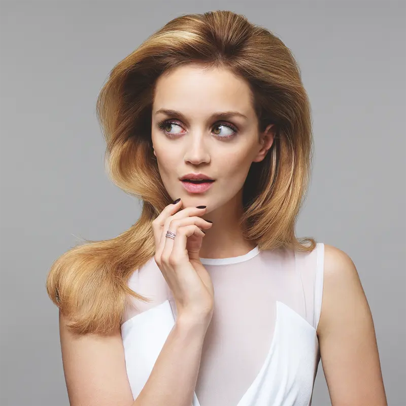 Woman with balayage hair styling at New You Clinic Holborn