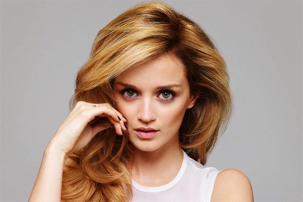 Happy client showing new hairstyle at New You Hair & Skin Clinic in Holborn.