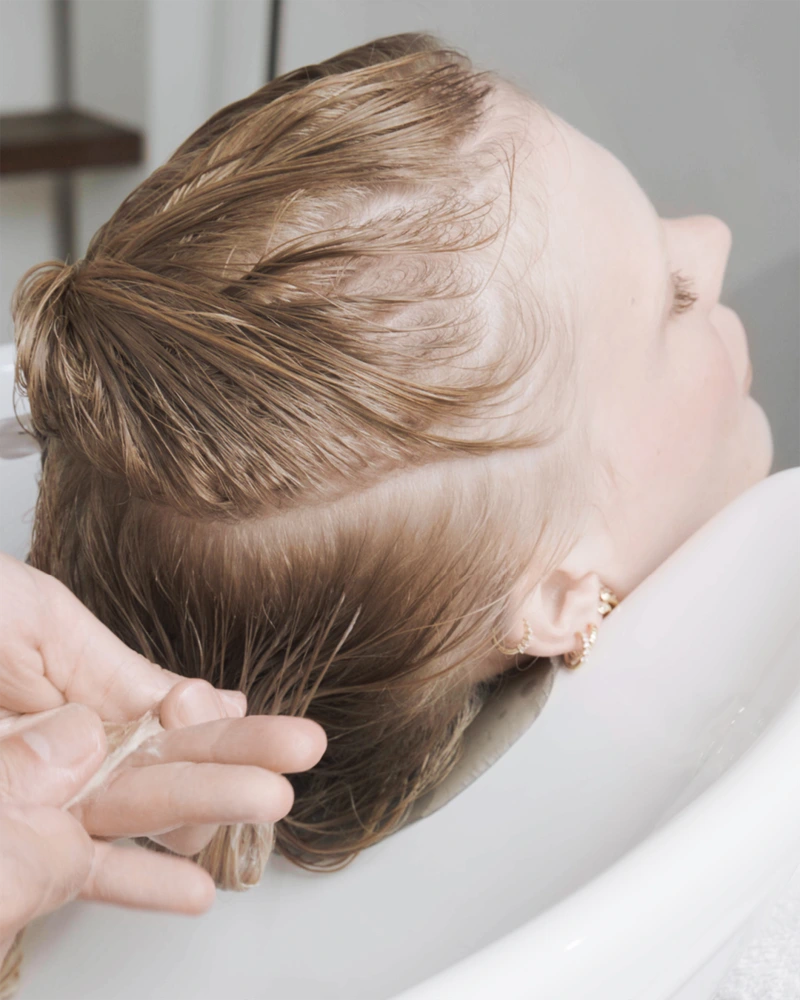 Olaplex bonding treatment application for damaged hair