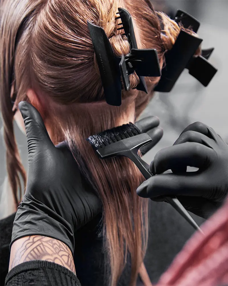 Applying organic hair colour at New You Hairdresser Holborn