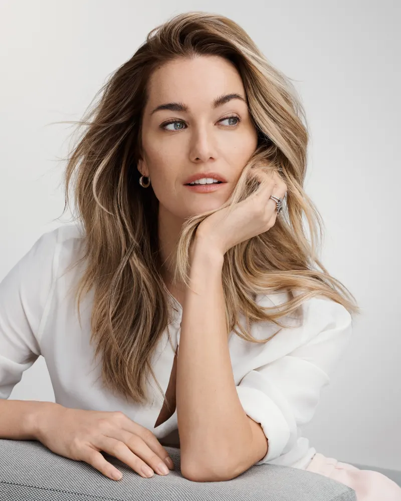 A relaxed healthcare professional enjoying a rejuvenating facial or hair treatment as part of a key worker discount.